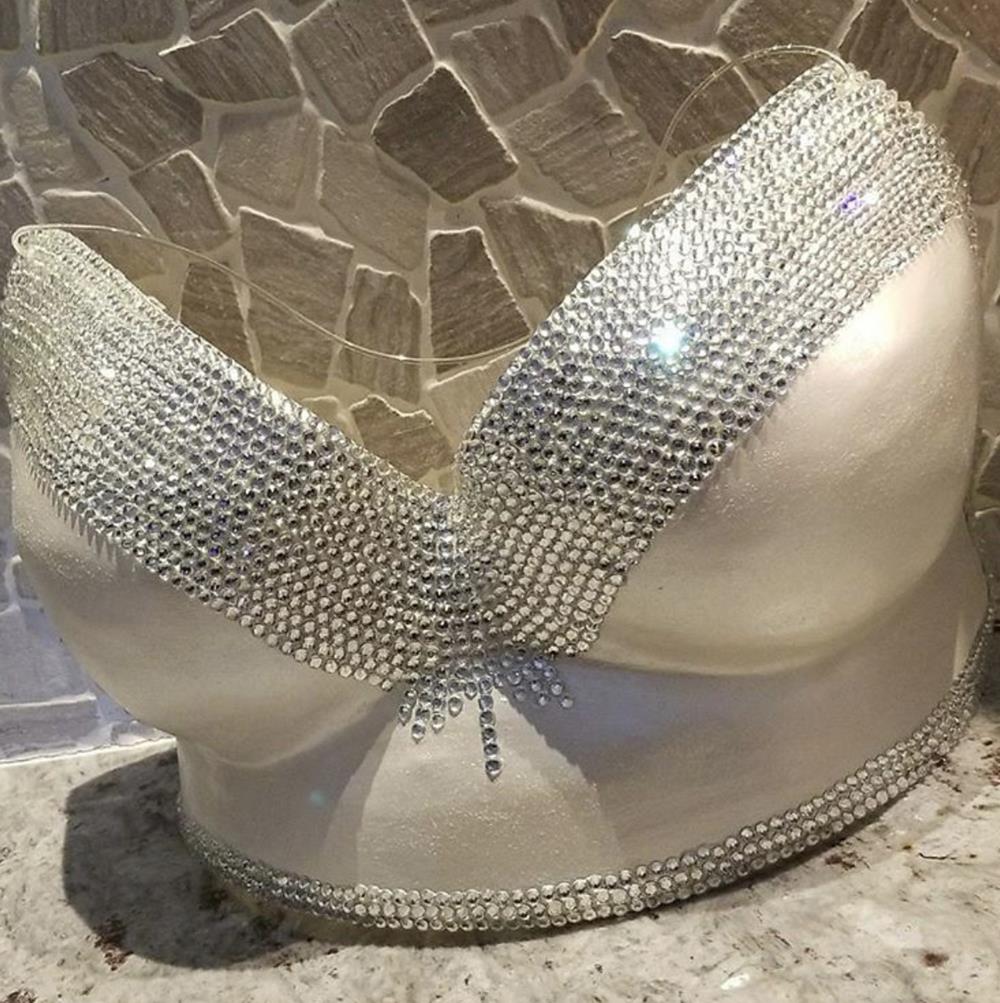 A breast cast covered in crystals and made by Casting By MJ.  