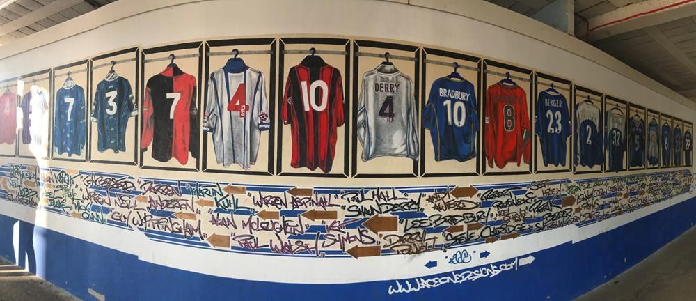 A mural featuring Portsmouth football shirts including Shaun Derry, Lee Bradbury and Robert Prosinecki, painted by Nigel Sharman AKA AceOne Designs.