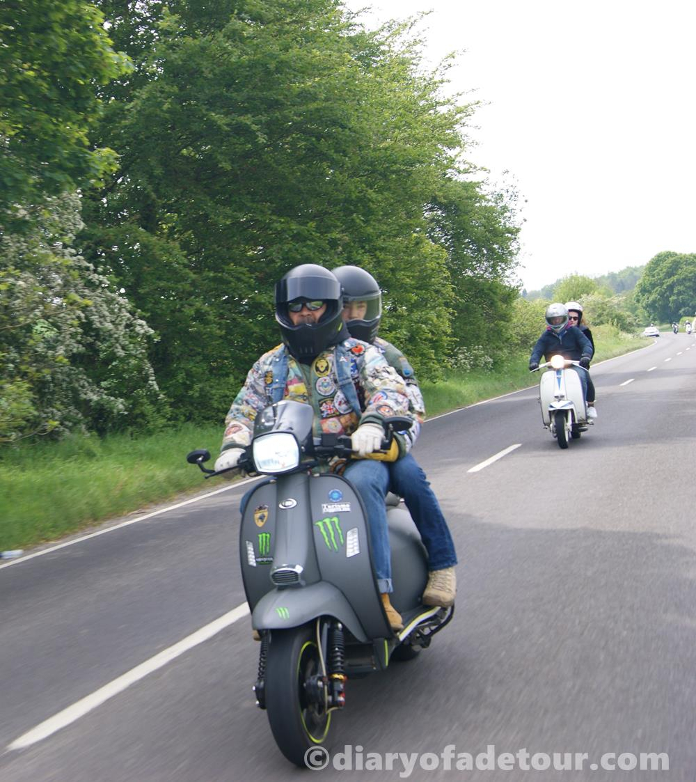 Rider on a Scomadi on a country road