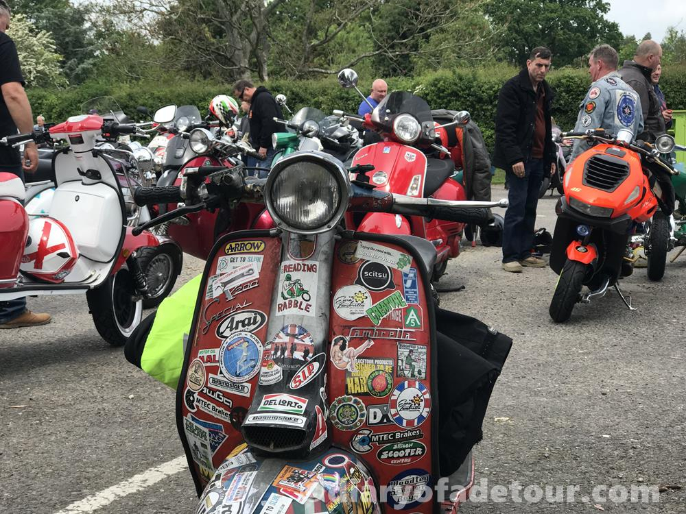 Rusty Lambretta with other scooters in the background
