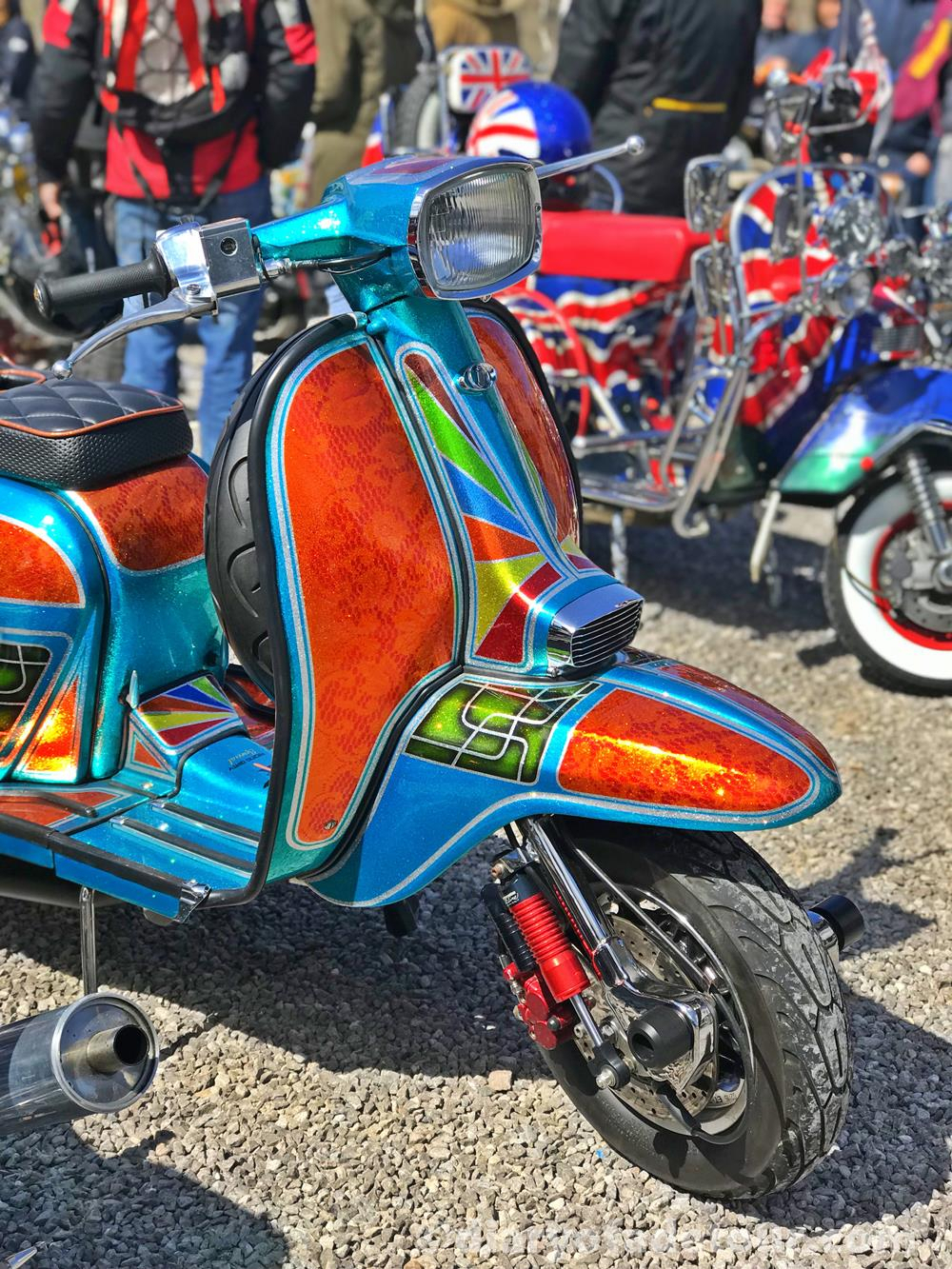 Brightly-coloured custom Lambretta painted by Riding Dirty Customs