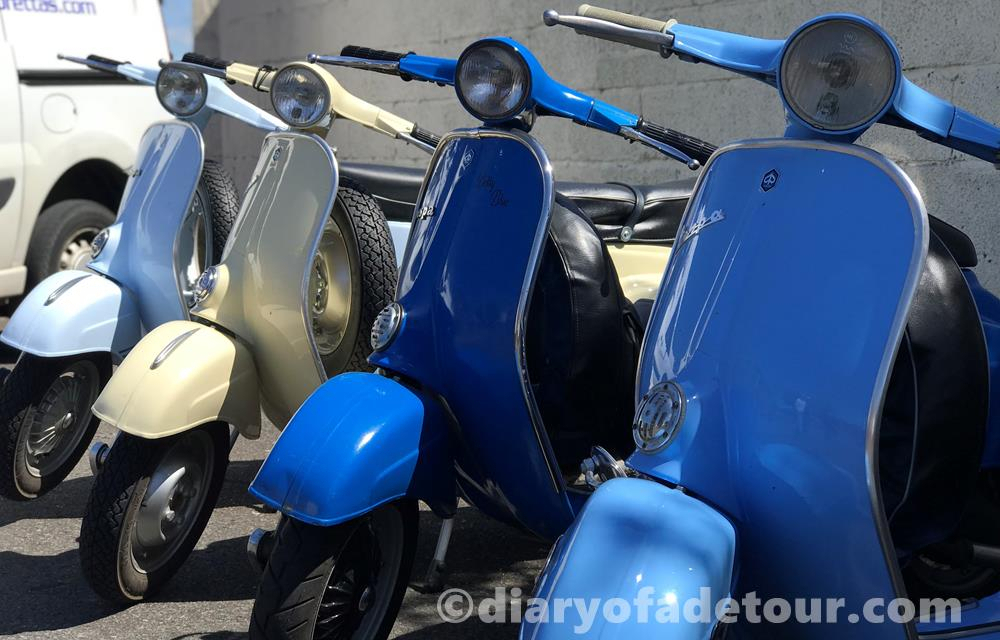 Row of Vespa smallframe scooters
