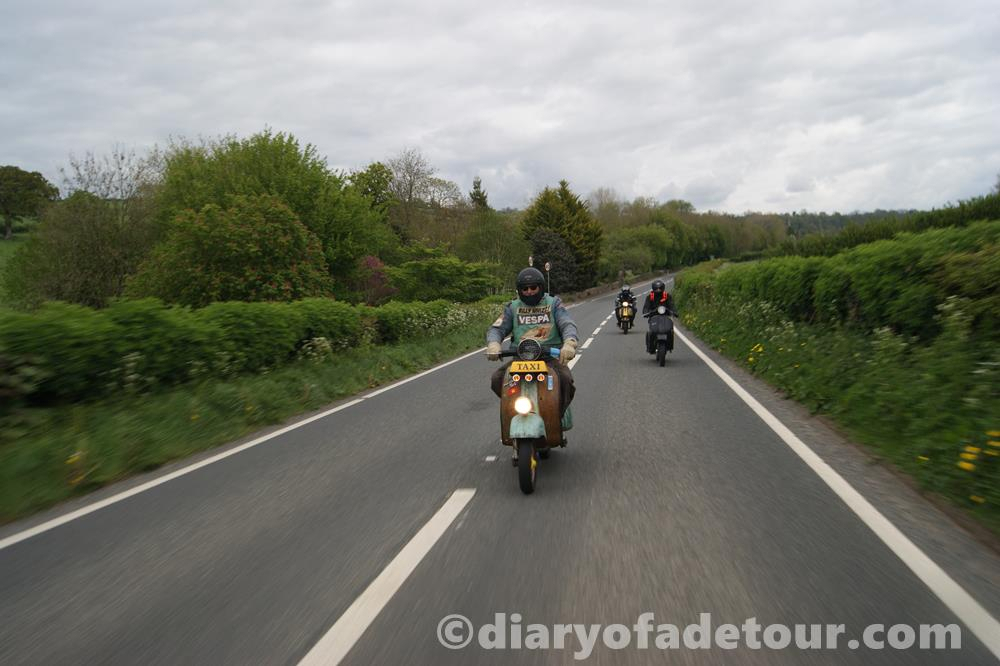 Scooters riding through the English countryside to the Weston Super Mare rally
