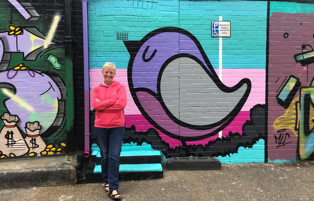 Me posing next to a Fark street art mural in Southsea