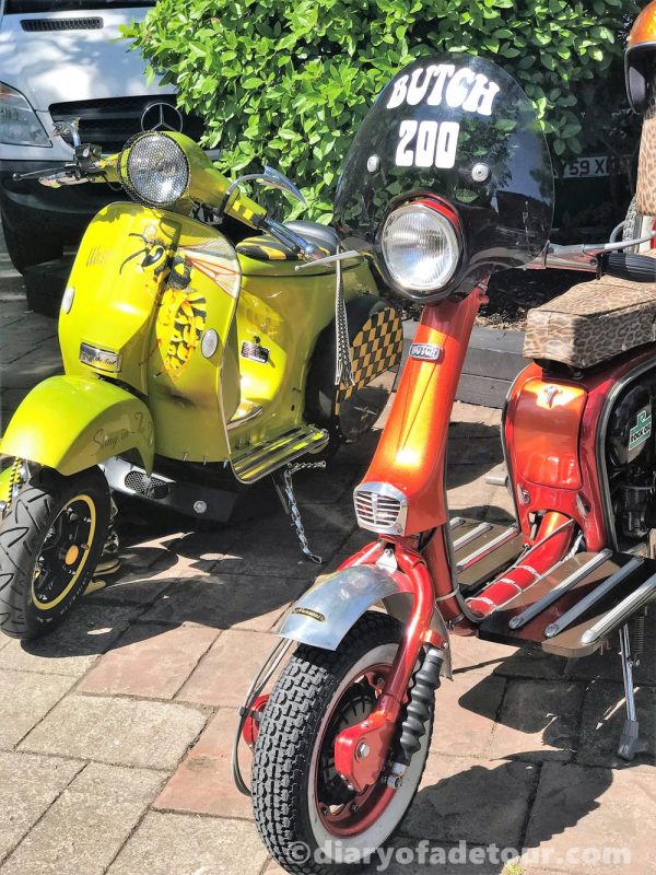 Wasp Vespa PX and red skeleton Lambretta