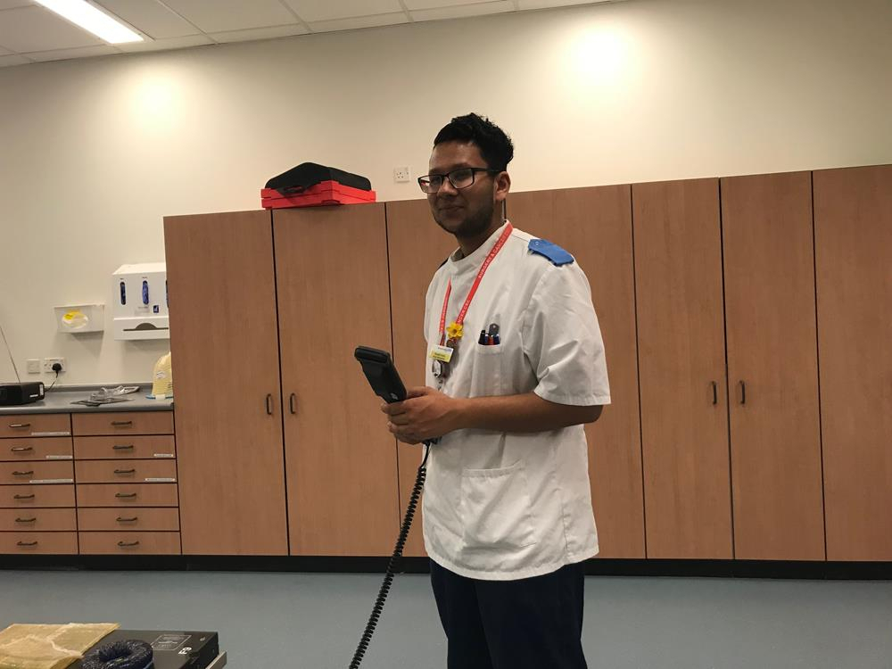 Radiologist operating radiotherapy remote control