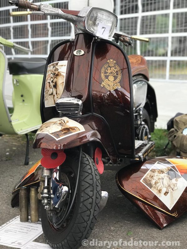 Brown custom Lambretta with murals featuring the British Army.