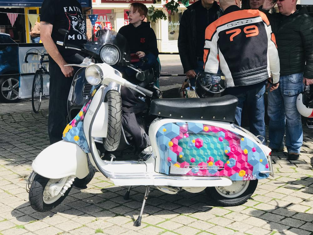 Lambretta Series 2 with street art on the side panel