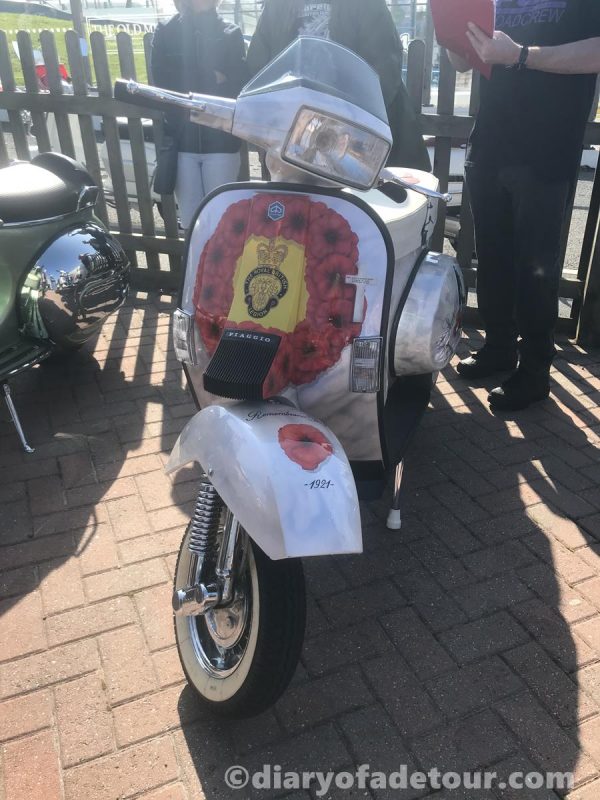 British Legion themed custom Vespa T5 with a poppy mural on the front legshields