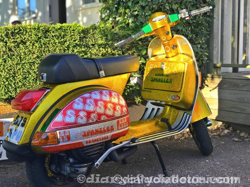 Custom yellow and orange metalflake Vespa with Spangles logos on the side panels.