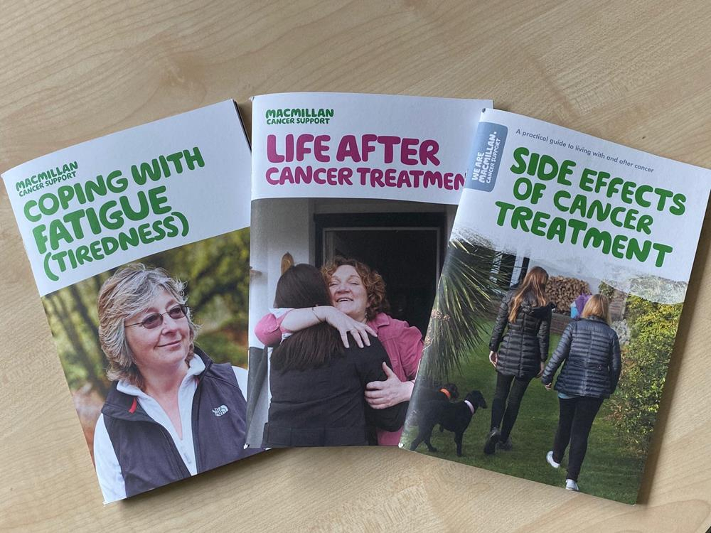 Three Macmillan cancer booklets on a table