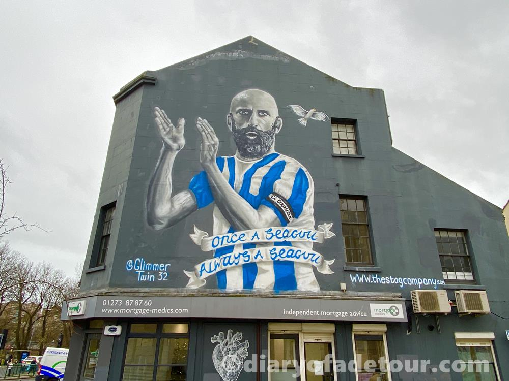 A large wall mural of Bruno Saltor, a retired Brighton player and legend