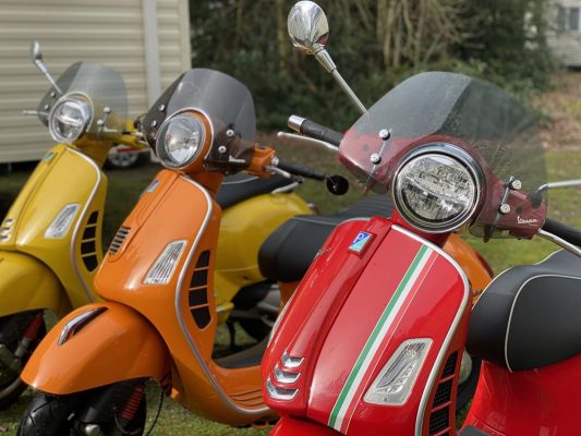 Red, orange and yellow GTS scooters