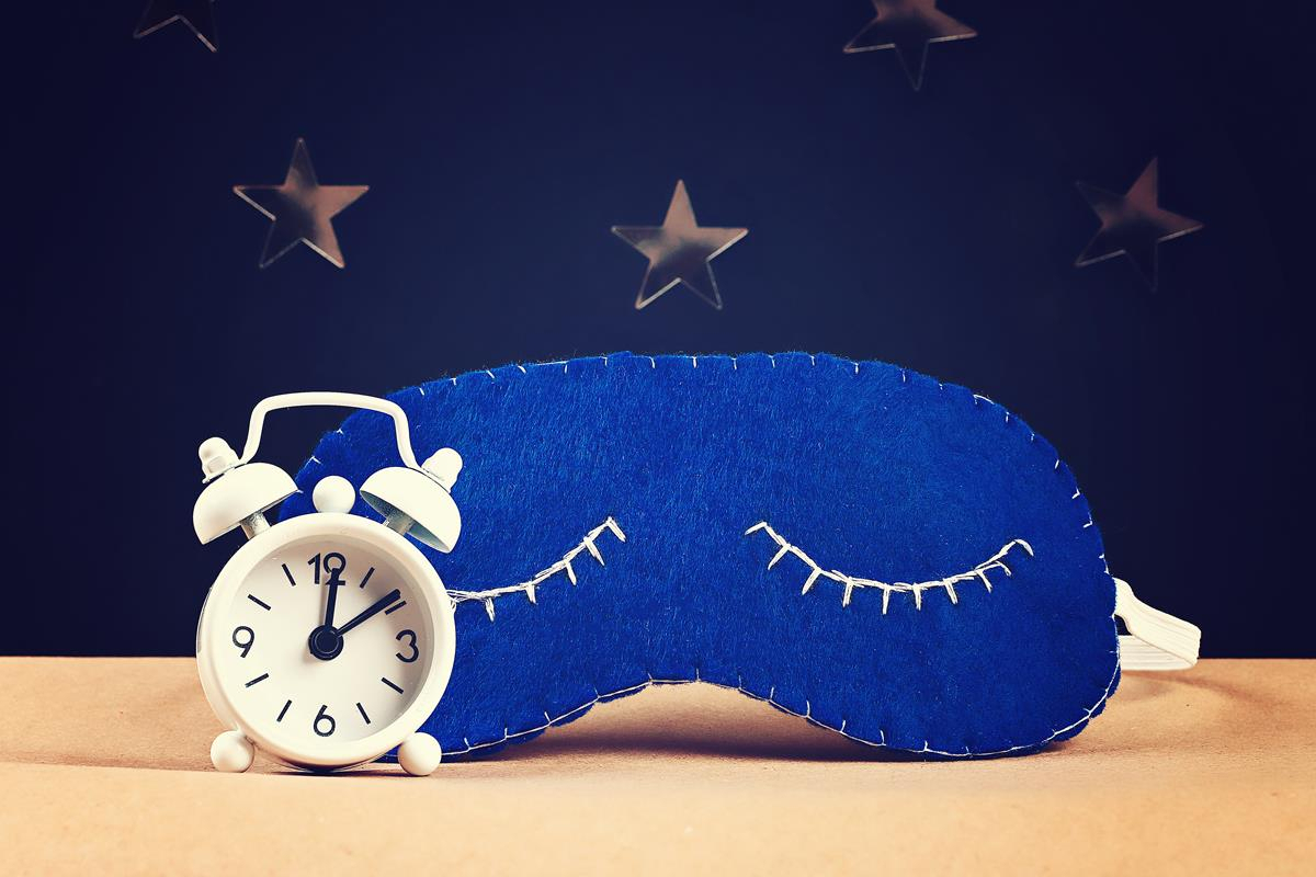 Sleep mask and alarm clock