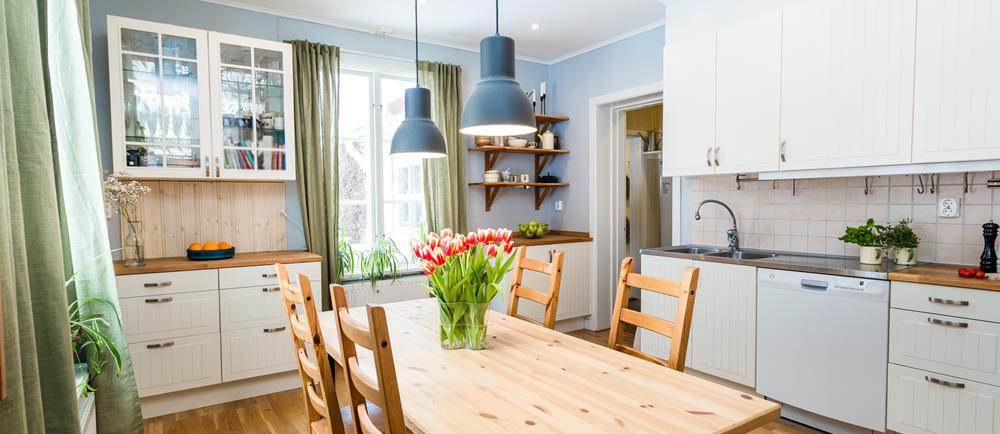 Modern kitchen with wooden table
