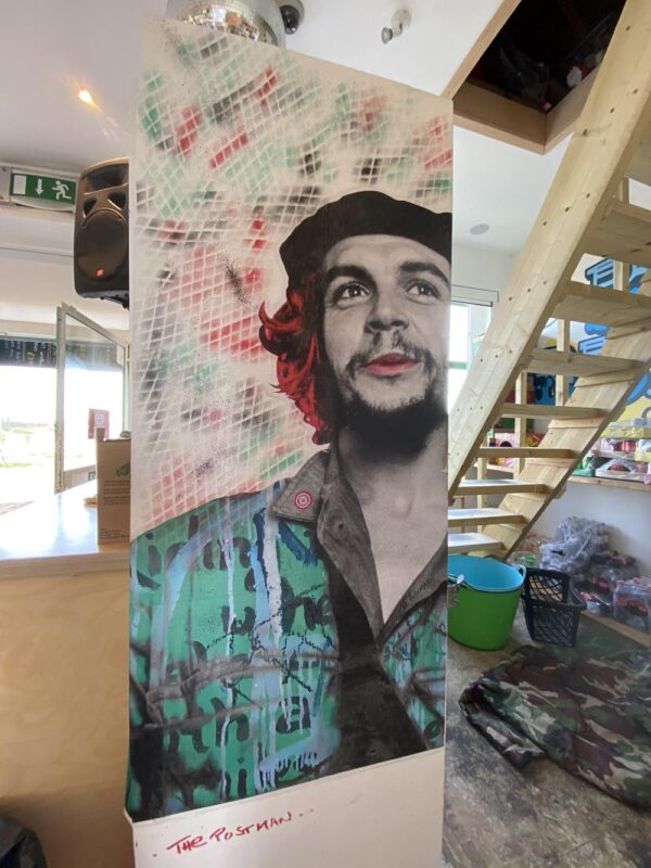 Paste up street art by the Postman Artist in the Big Beach Cafe, Hove