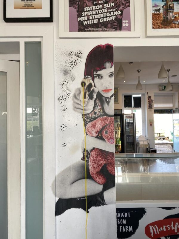 Paste up street art by the Postman Artist in the Big Beach Cafe, Hove