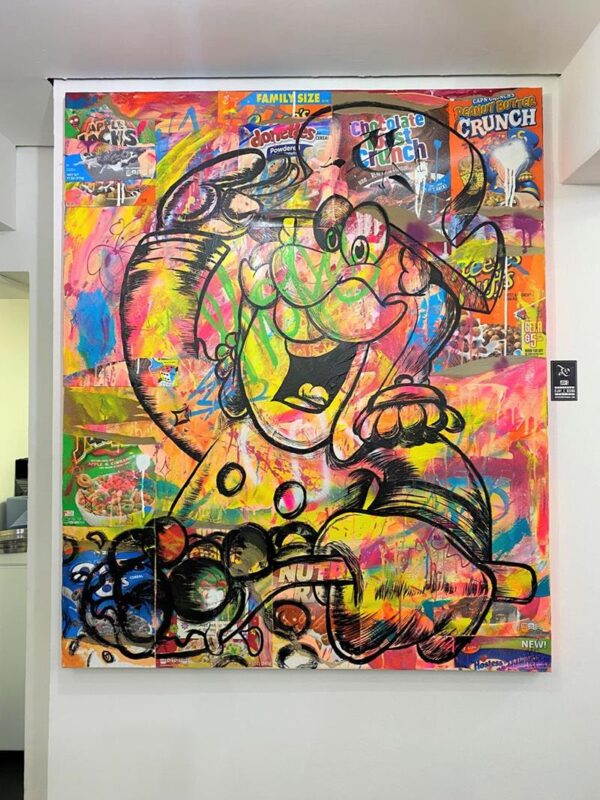 A wall in the Brighton cereal cafe with a character painted over some cereal boxes