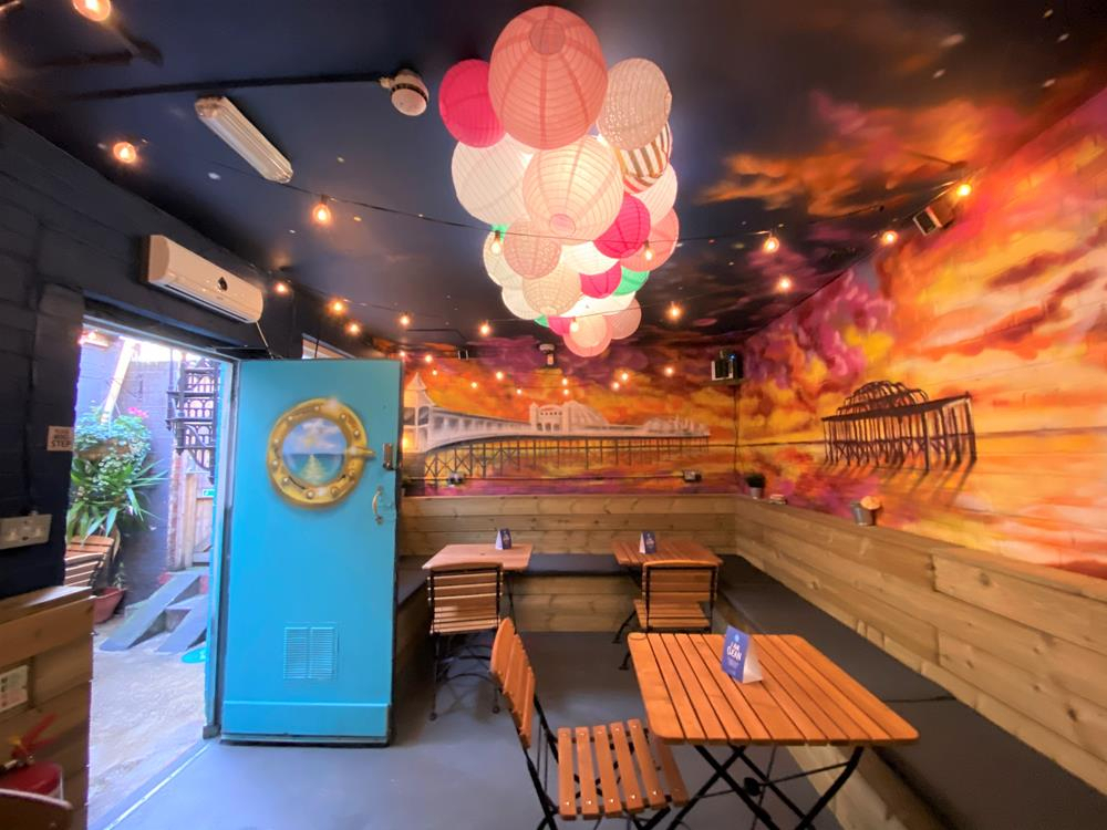 A mural of Brighton's west pier in the back room of the Druid's Head pub in Brighton