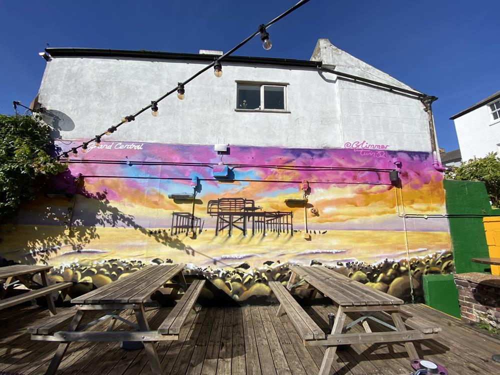 A mural of Brighton's west pier in the garden of the Grand Central pub in Brighton