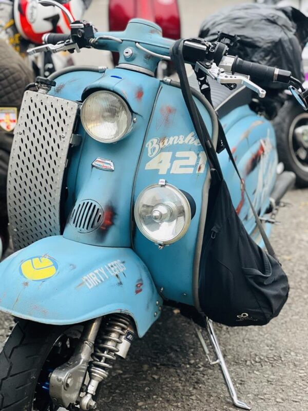 Front view of the Naked Again scooter, a Lambretta Series 1 in sky blue with signwriting