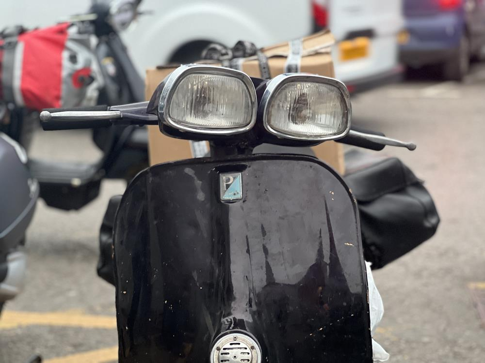 A vespa oddity with two front lights