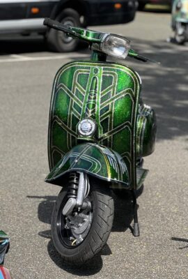 A green and gold metalflake smallframe Vespa