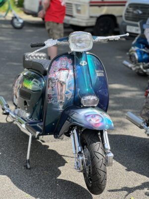 Puddin, a custom Lambretta with Harley Quinn murals and theme.