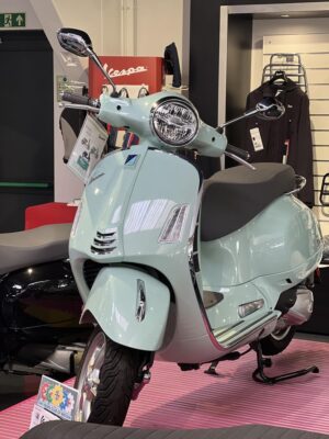 A pale green Vespa GTS 300 HPE2 on display in the Dearden Motorcycles showroom