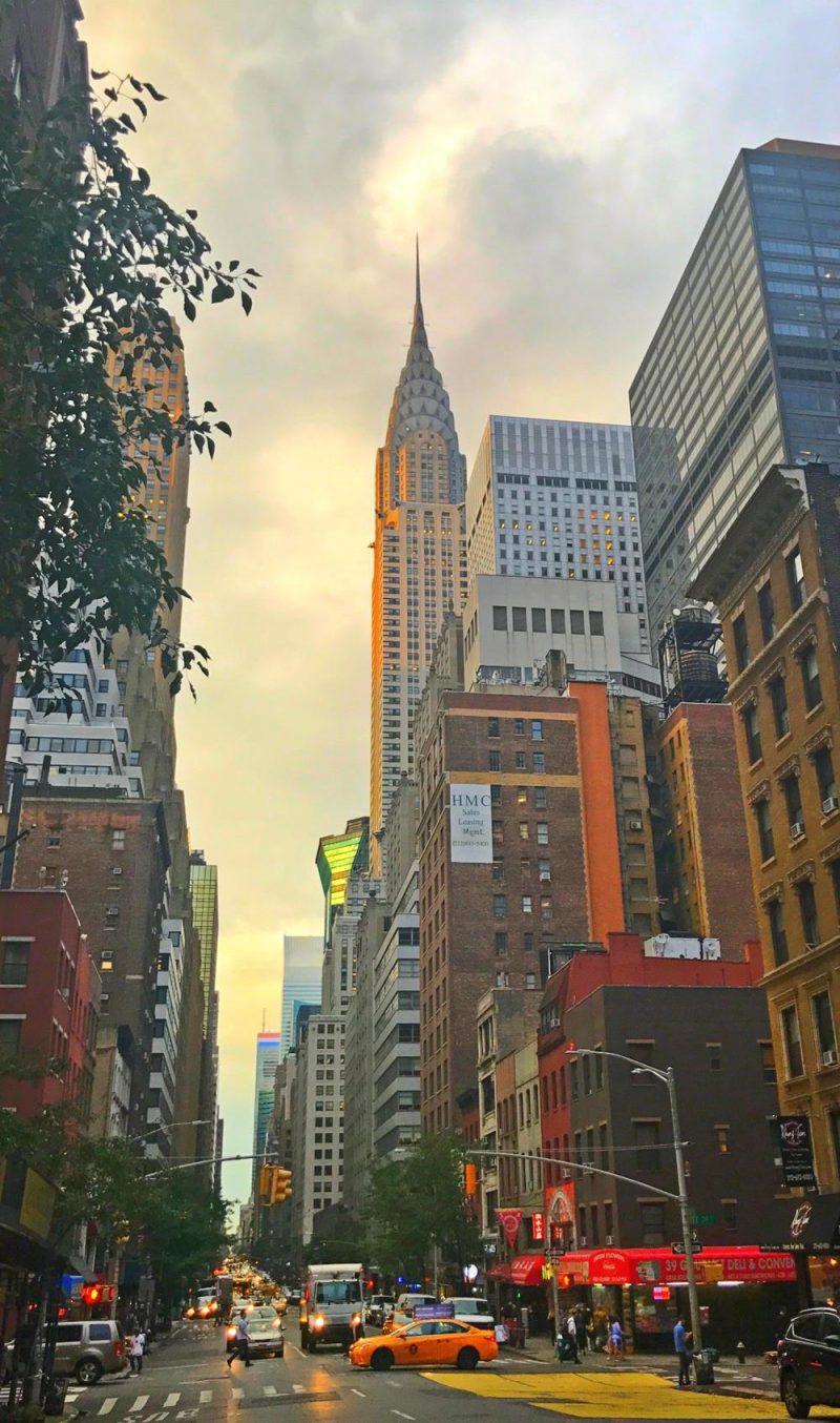 View of the top of the Chrysler building from the street as sun is setting