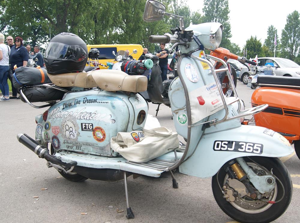 Pale blue Lambretta scooter with stickers