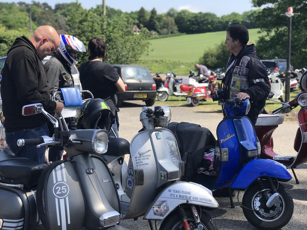 Vespa PX scooters parked at the Greyhound Pub in Midhurst for the Bulldog Run